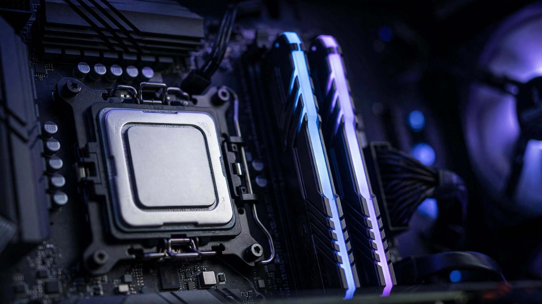 Modern gaming CPU installed on a motherboard next to DDR5 RAM sticks, showing hardware that matters for 240 FPS gaming